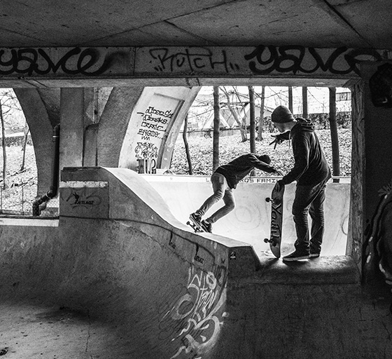 Skateboarder doing a feable stall