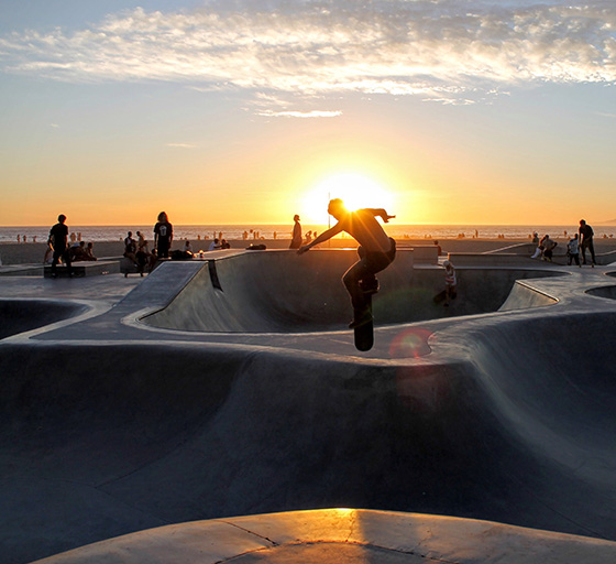 Skateboarder airing out of bowl