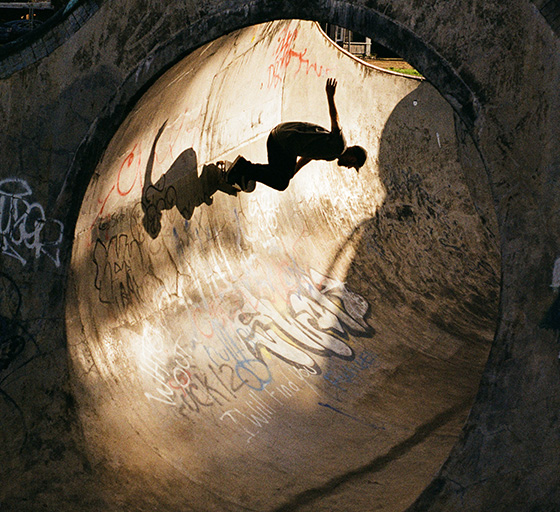 Skateboarder pumps street transition